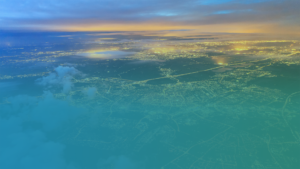 Large image of a cityscape with a gradient of blue to green overlaid